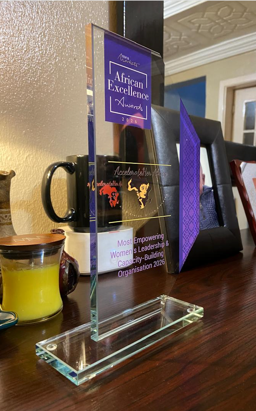 AccelerateHER Africa receiving the African Excellence Awards 2026 physical trophy